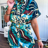 Welcome to the jungle in this bold rainforest-inspired print romper that commands attention. Crafted in rich earth tones, it features a button down front and two buttoned front pockets, a classic collar, and a matching fabric belt that cinches your silhouette. The relaxed design flows effortlessly, and yes—it has pockets