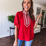Cool red dolman style top with white and red gingham trim at the mock neck and yoke.