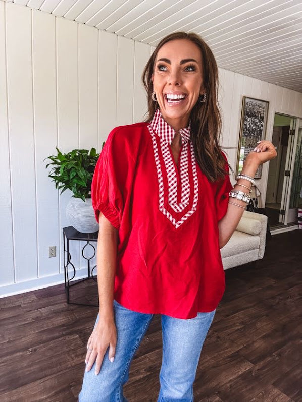 Cool red dolman style top with white and red gingham trim at the mock neck and yoke.