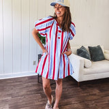 Light blue, white and red striped mini dress featuring a V neck and mock collar, puffed sleeves and pockets.