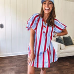 Light blue, white and red striped mini dress featuring a V neck and mock collar, puffed sleeves and pockets.