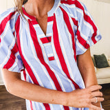 Light blue, white and red striped mini dress featuring a V neck and mock collar, puffed sleeves and pockets.