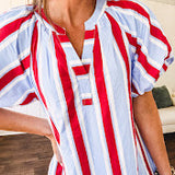 Light blue, white and red striped mini dress featuring a V neck and mock collar, puffed sleeves and pockets.