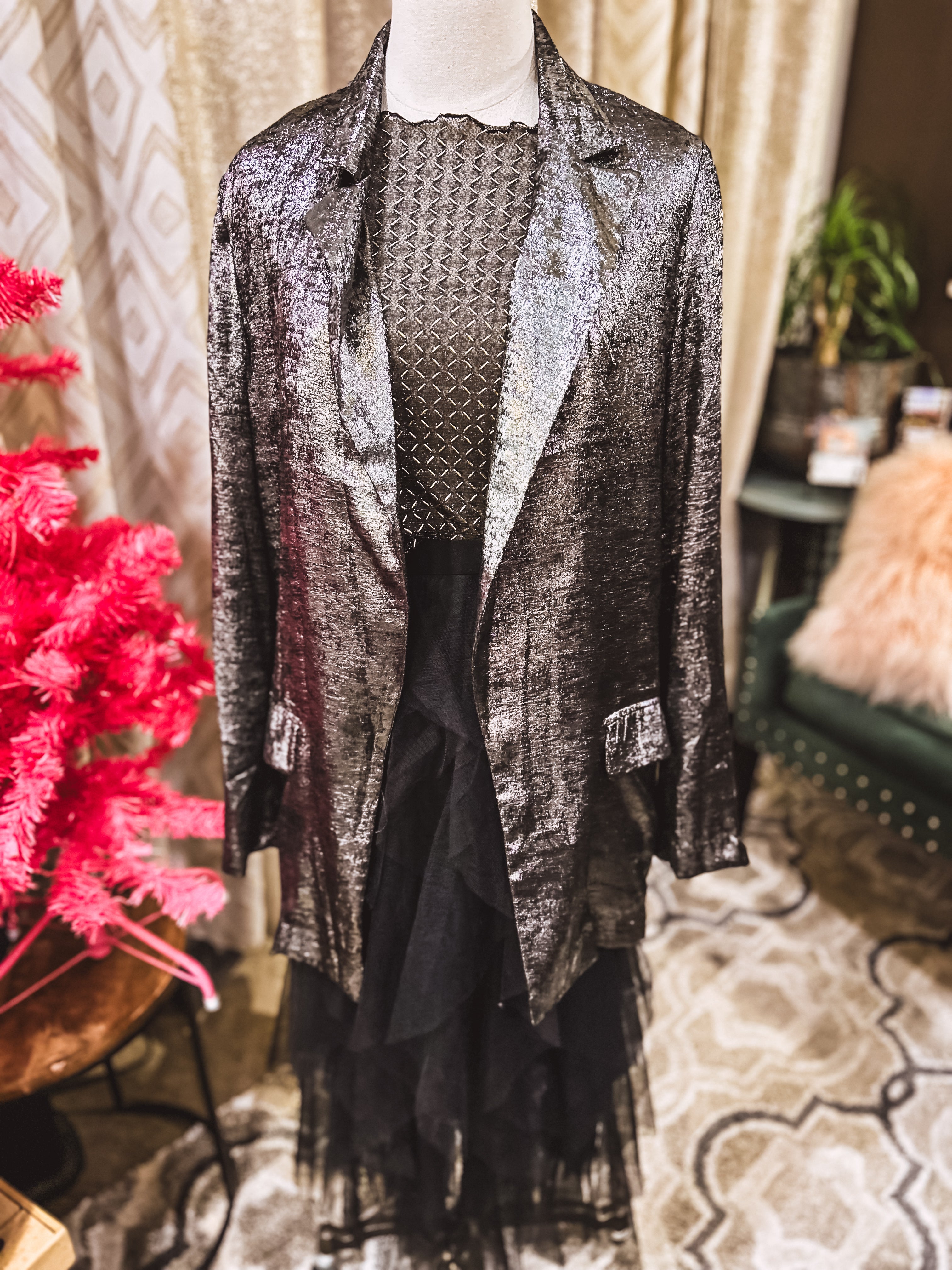 Black long sleeved mesh with gold diamond pattern.