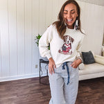 Cream and dusty blue thin striped barrel pants with silver grommet belt loops and dusty blue rope belt with oversized pockets.