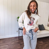 Cream and dusty blue thin striped barrel pants with silver grommet belt loops and dusty blue rope belt with oversized pockets.