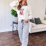 Cream and dusty blue thin striped barrel pants with silver grommet belt loops and dusty blue rope belt with oversized pockets.