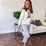 Cream and dusty blue thin striped barrel pants with silver grommet belt loops and dusty blue rope belt with oversized pockets.