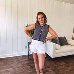White short inseam raw hem stretchy shorts with button down closure.