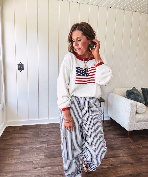 Cream and navy striped elastic waist pants with oversized pockets.