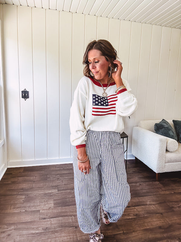 Cream and navy striped elastic waist pants with oversized pockets.
