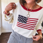 Cream and navy striped elastic waist pants with oversized pockets.