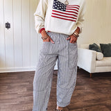Cream and navy striped elastic waist pants with oversized pockets.