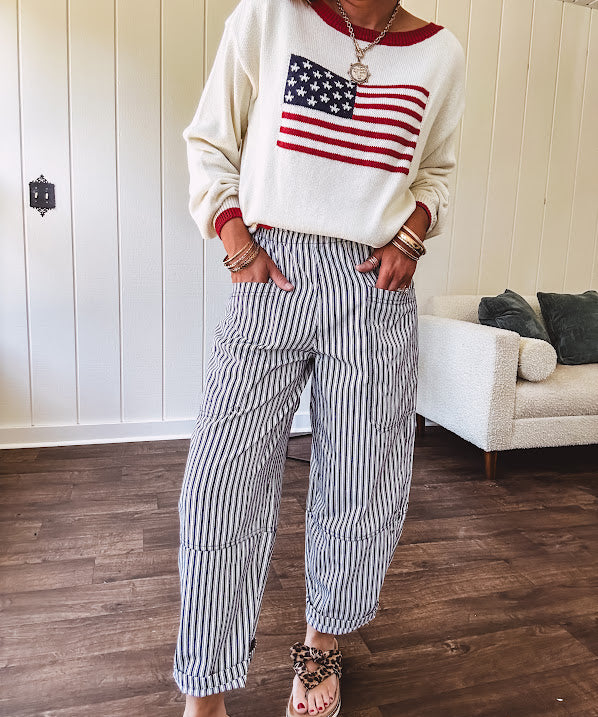 Cream and navy striped elastic waist pants with oversized pockets.