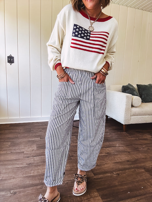 Cream and navy striped elastic waist pants with oversized pockets.