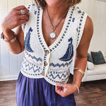 Cream and navy three button front sweater vest with V neck and sailboat motif.