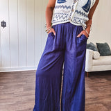 Navy wide leg satin pants with elastic waistband and pockets