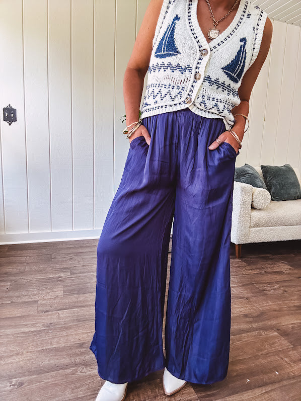 Navy wide leg satin pants with elastic waistband and pockets