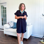 The scoop hem is a flattering fit that is sure to be the star of the show. This black 1/4 zip dress combines comfort with contemporary style, featuring a distinctive scoop hem that creates an elegant silhouette.