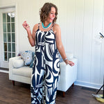 Turn heads this season in our Black + Cream Abstract Trellis Jumpsuit—the effortless piece that does all the work for you. Crafted from lightweight, breathable polyester, this playful abstract print jumpsuit features adjustable straps with a drawstring at the back, elastic neckline details, and a flattering wide-leg silhouette that moves with you. 