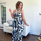 Turn heads this season in our Black + Cream Abstract Trellis Jumpsuit—the effortless piece that does all the work for you. Crafted from lightweight, breathable polyester, this playful abstract print jumpsuit features adjustable straps with a drawstring at the back, elastic neckline details, and a flattering wide-leg silhouette that moves with you. 