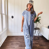 Soft terry-like cotton jumpsuit in indigo and light blue stripes with star patches throughout with lace embellishments. Wide lg design and faux wooden buttons down the front.