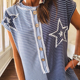 Soft terry-like cotton jumpsuit in indigo and light blue stripes with star patches throughout with lace embellishments. Wide lg design and faux wooden buttons down the front.