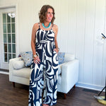 Turn heads this season in our Black + Cream Abstract Trellis Jumpsuit—the effortless piece that does all the work for you. Crafted from lightweight, breathable polyester, this playful abstract print jumpsuit features adjustable straps with a drawstring at the back, elastic neckline details, and a flattering wide-leg silhouette that moves with you. 