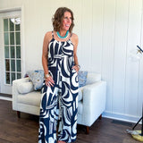 Turn heads this season in our Black + Cream Abstract Trellis Jumpsuit—the effortless piece that does all the work for you. Crafted from lightweight, breathable polyester, this playful abstract print jumpsuit features adjustable straps with a drawstring at the back, elastic neckline details, and a flattering wide-leg silhouette that moves with you. 