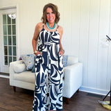 Turn heads this season in our Black + Cream Abstract Trellis Jumpsuit—the effortless piece that does all the work for you. Crafted from lightweight, breathable polyester, this playful abstract print jumpsuit features adjustable straps with a drawstring at the back, elastic neckline details, and a flattering wide-leg silhouette that moves with you. 