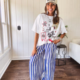 Blue and white striped wide leg pants with elastic back waist and flat front with large side pockets.