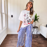 Blue and white striped wide leg pants with elastic back waist and flat front with large side pockets.