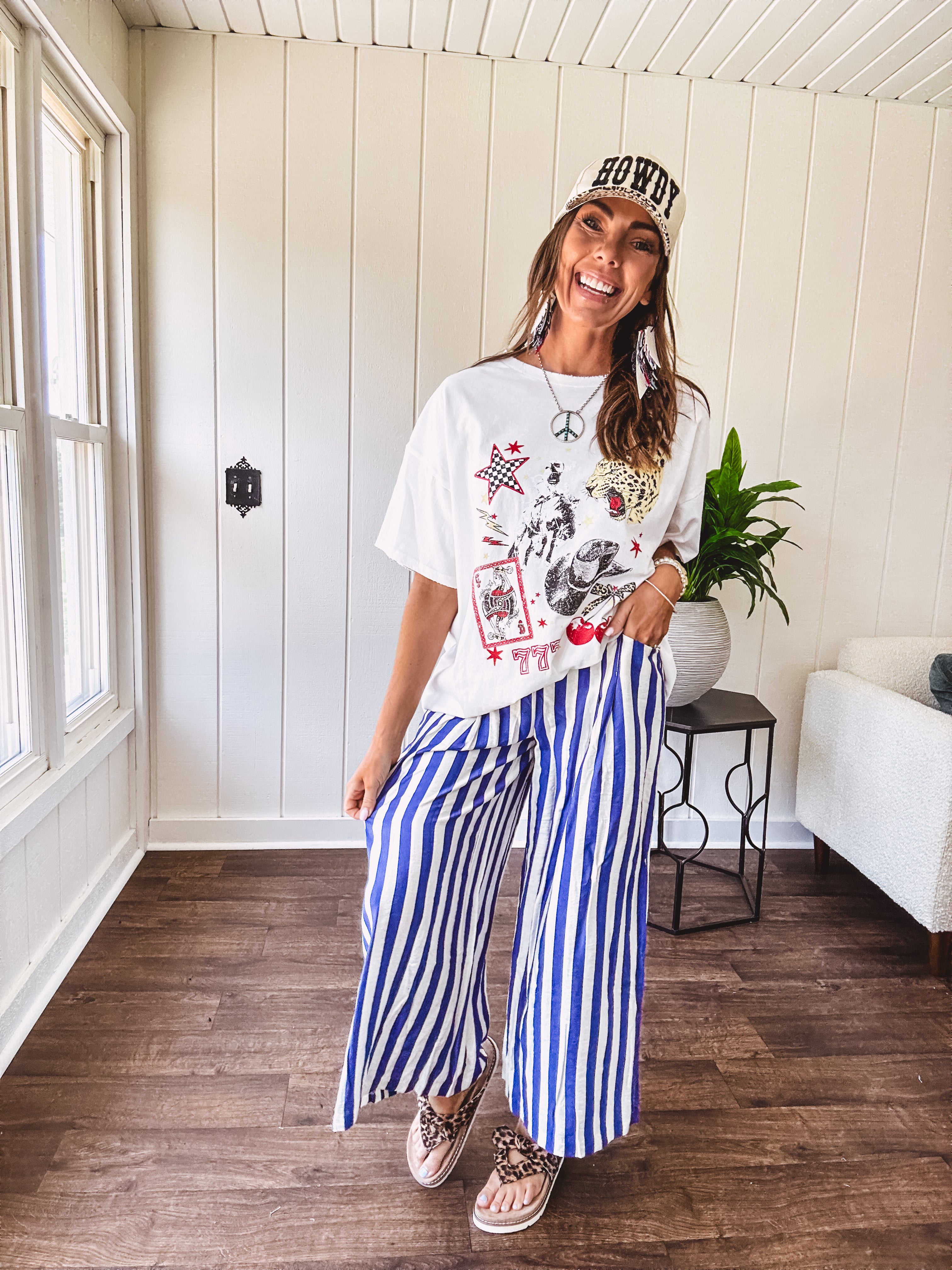 Blue and white striped wide leg pants with elastic back waist and flat front with large side pockets.