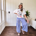 Blue and white striped wide leg pants with elastic back waist and flat front with large side pockets.
