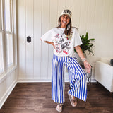 Blue and white striped wide leg pants with elastic back waist and flat front with large side pockets.