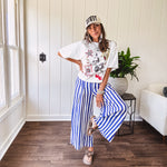 Blue and white striped wide leg pants with elastic back waist and flat front with large side pockets.