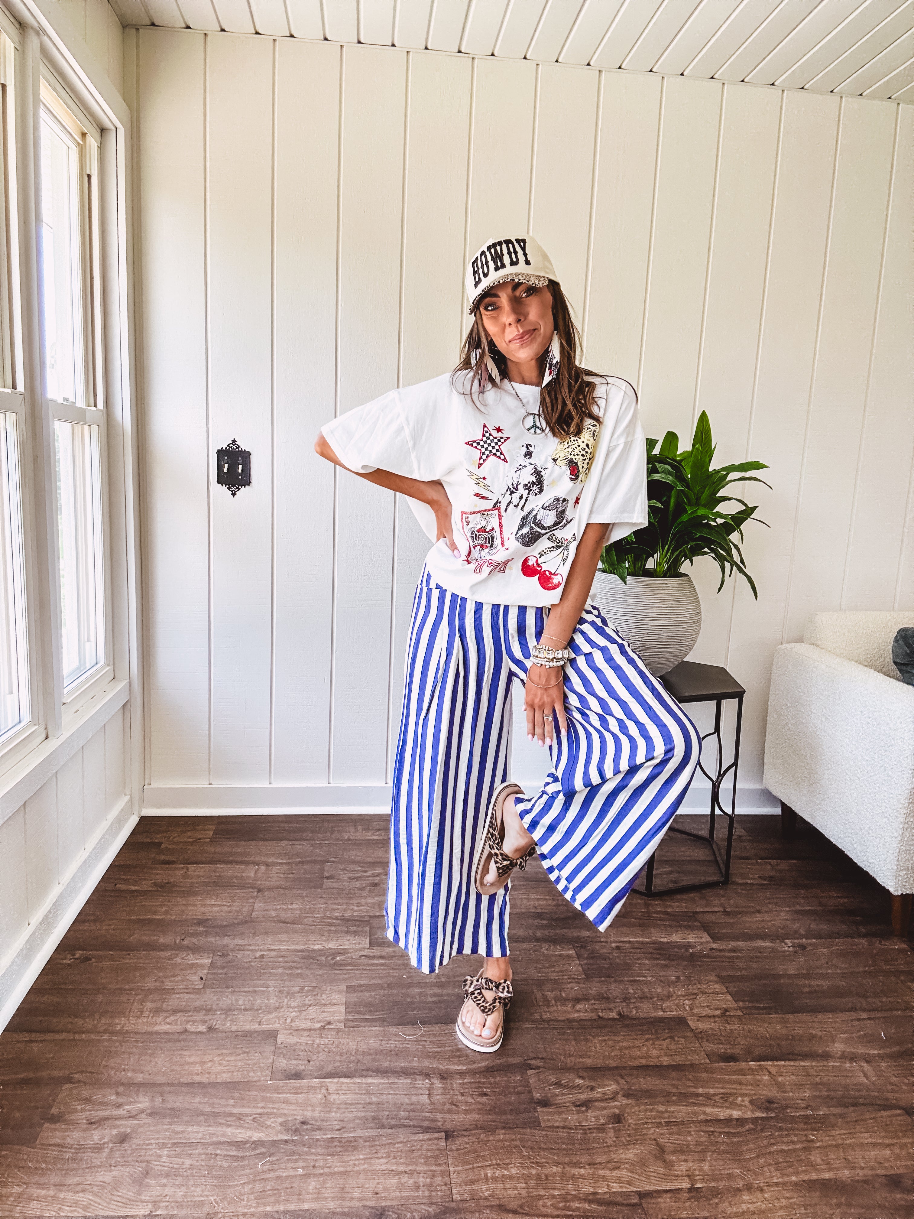 Blue and white striped wide leg pants with elastic back waist and flat front with large side pockets.