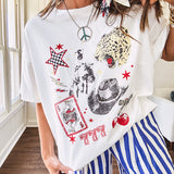 White oversized tee featuring a mixed print of black, red and cream in western, leo and playing card theme.