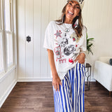 Blue and white striped wide leg pants with elastic back waist and flat front with large side pockets.
