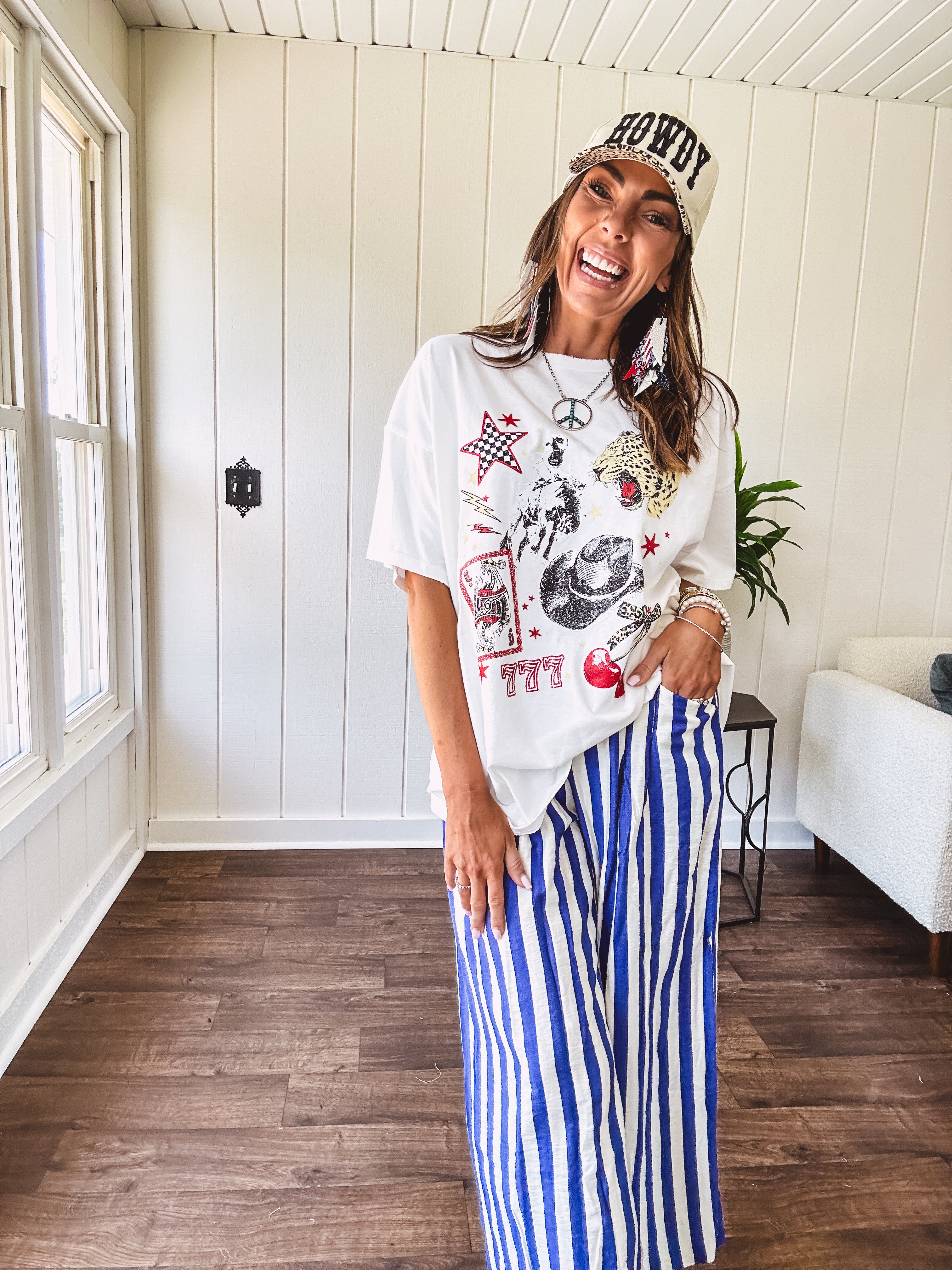 Blue and white striped wide leg pants with elastic back waist and flat front with large side pockets.