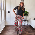 Thin, silky classic leopard design wide leg pants with red number 7 billiard balls throughout with red, white and black stripe down the sides and elastic drawstring waist and pockets.