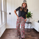 Black cotton short sleeved tee with multi colored mini rhinestones throughout.