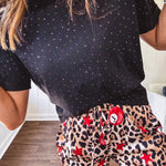 Black cotton short sleeved tee with multi colored mini rhinestones throughout.