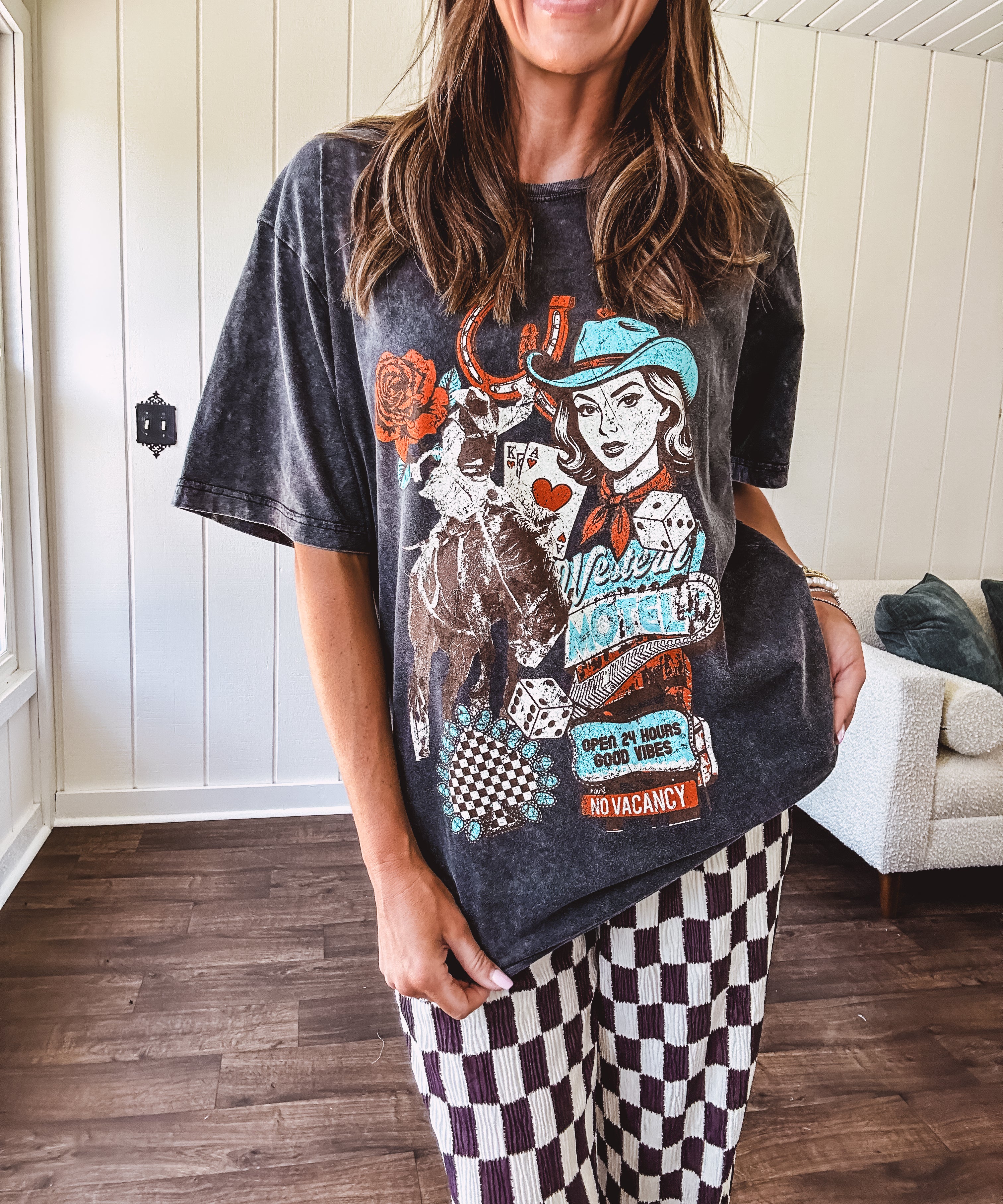 Mineral washed charcoal tee with teal, cream and rust cowgirl graphics and vintage inspired motel pic.