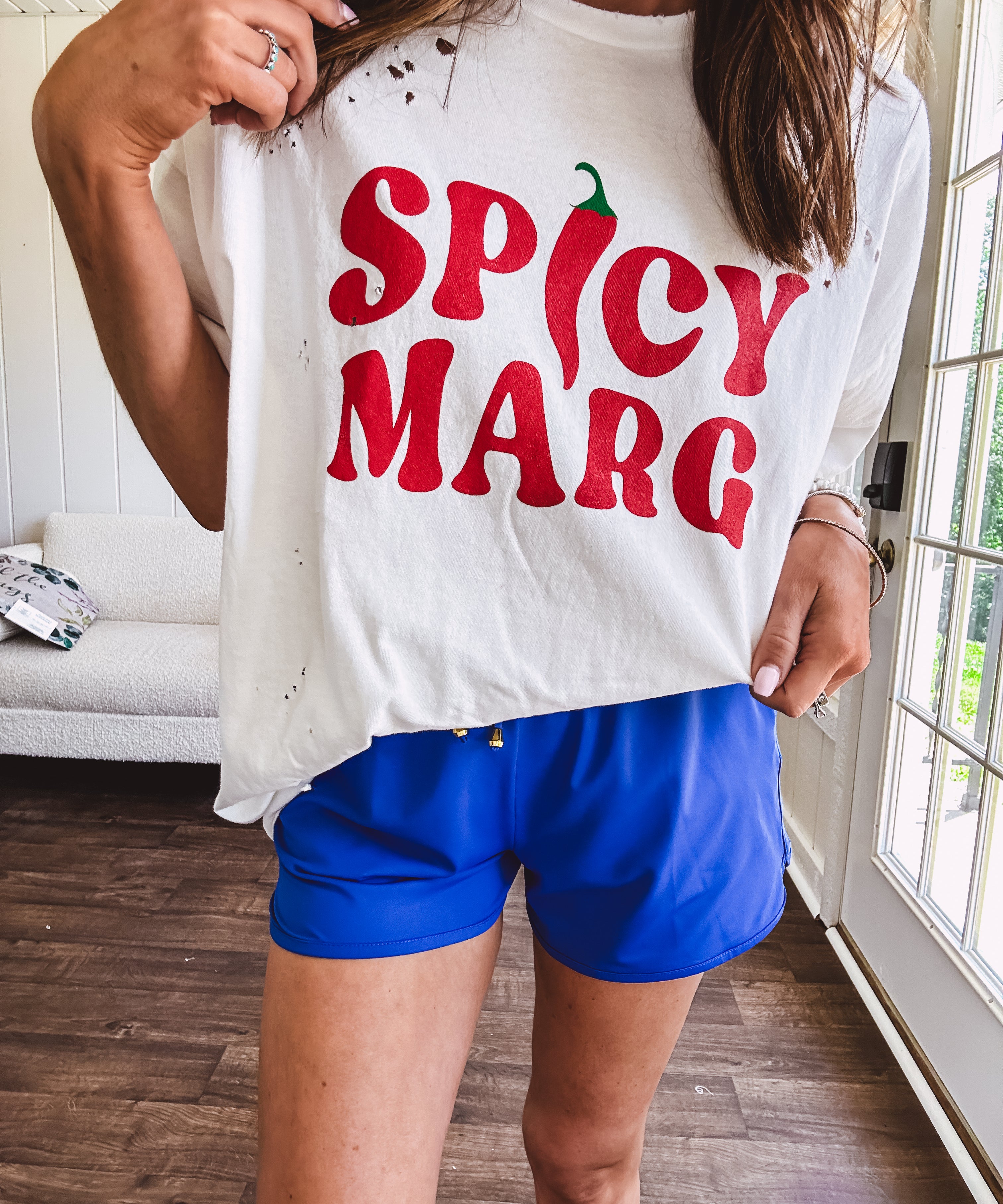 Thin, royal blue athleisure shorts with elastic drawstring waist and pockets.