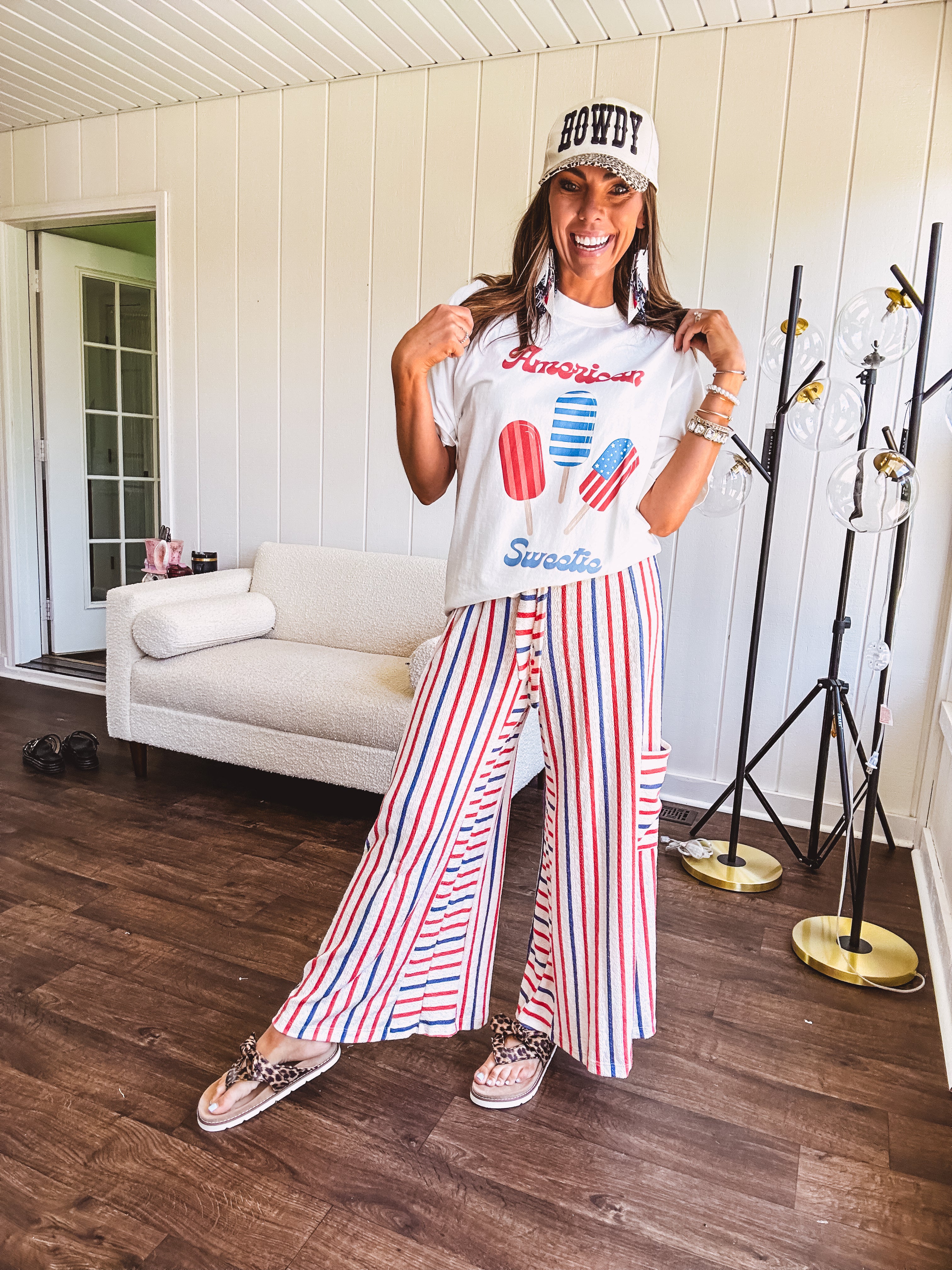White cotton tee with blue and red "American Sweet" and popsicle graphics on front.