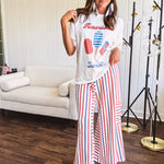 Thin, lightweight textured wide leg pant with red, blue and cream stripes with elastic drawstring waist and side pockets.