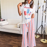 Thin, lightweight textured wide leg pant with red, blue and cream stripes with elastic drawstring waist and side pockets.