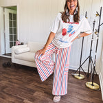 Thin, lightweight textured wide leg pant with red, blue and cream stripes with elastic drawstring waist and side pockets.
