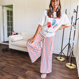 Thin, lightweight textured wide leg pant with red, blue and cream stripes with elastic drawstring waist and side pockets.